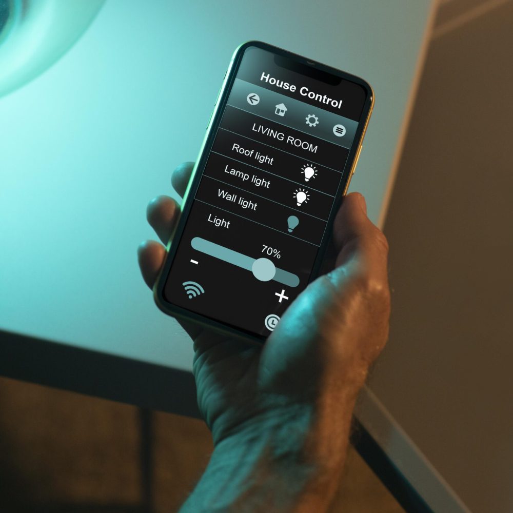 man-using-smartphone-his-automated-home man-using-smartphone-his-automated-home